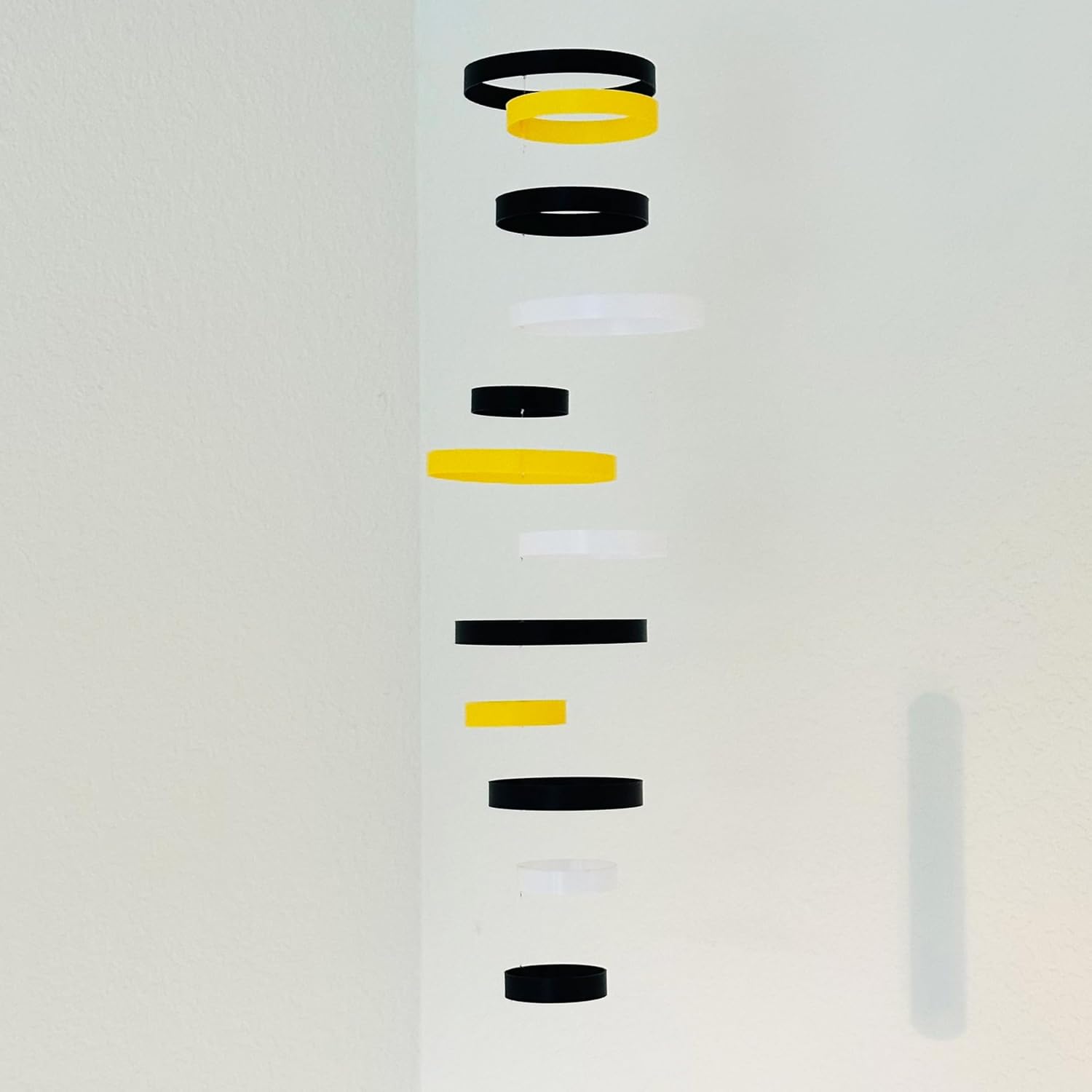 Whirlwind Kinetic Mobile with 12 Rings in Black Yellow and White